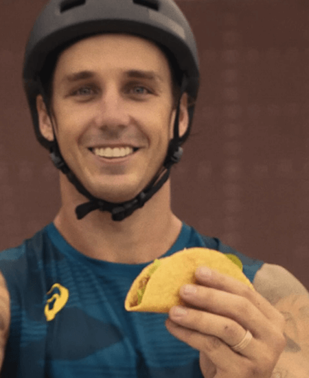 logan martin holding taco in hand